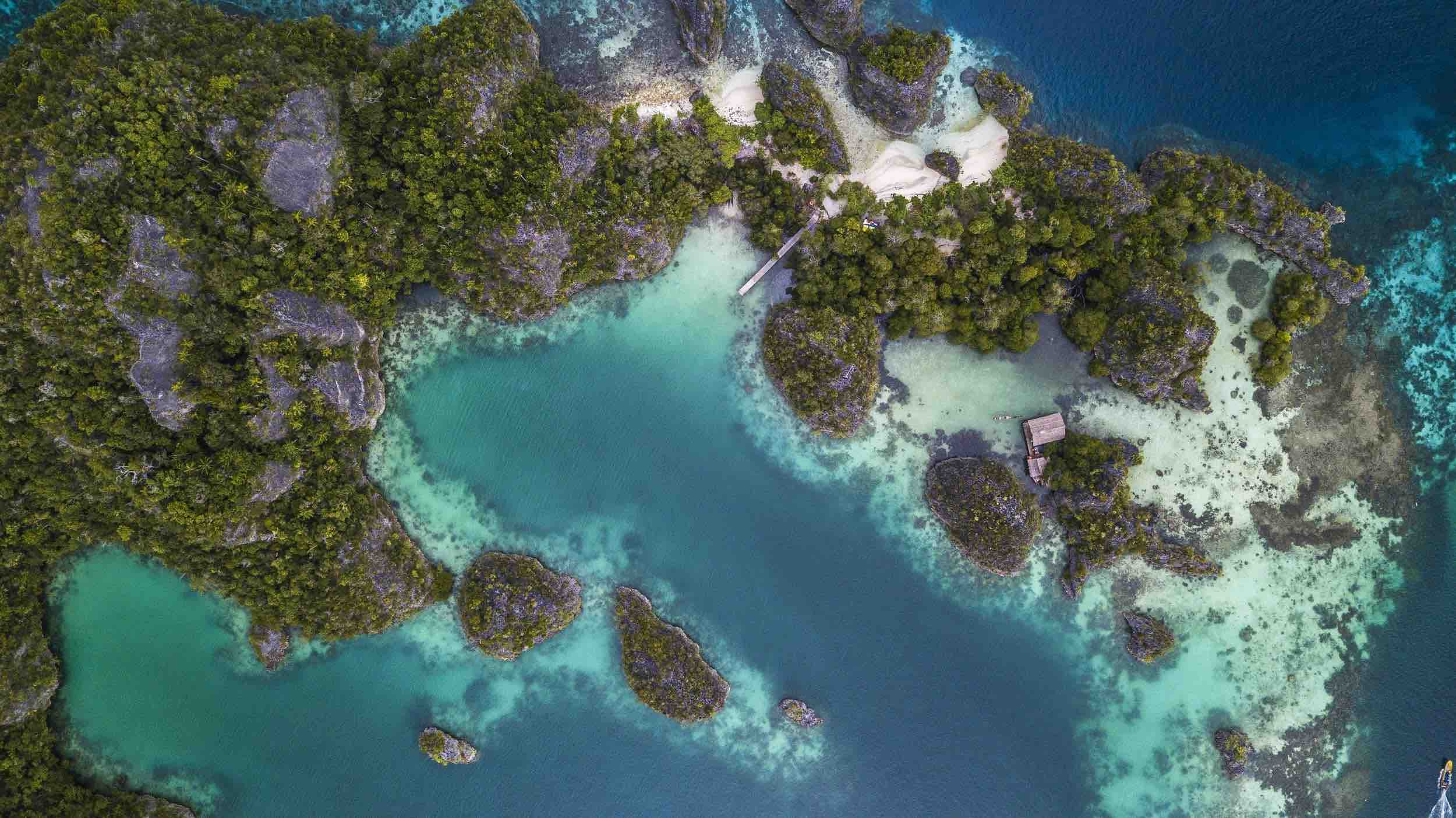 Pianemo islands aerial view in Raja Ampat, Indonesia by Papua Diving Resorts team
