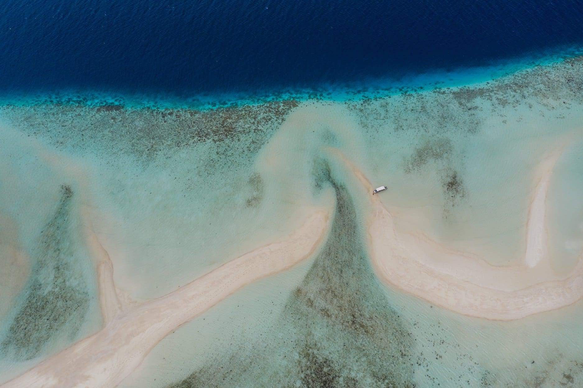 sand bar drone view from above in Raja Ampat, Indonesia by Papua Diving Resorts