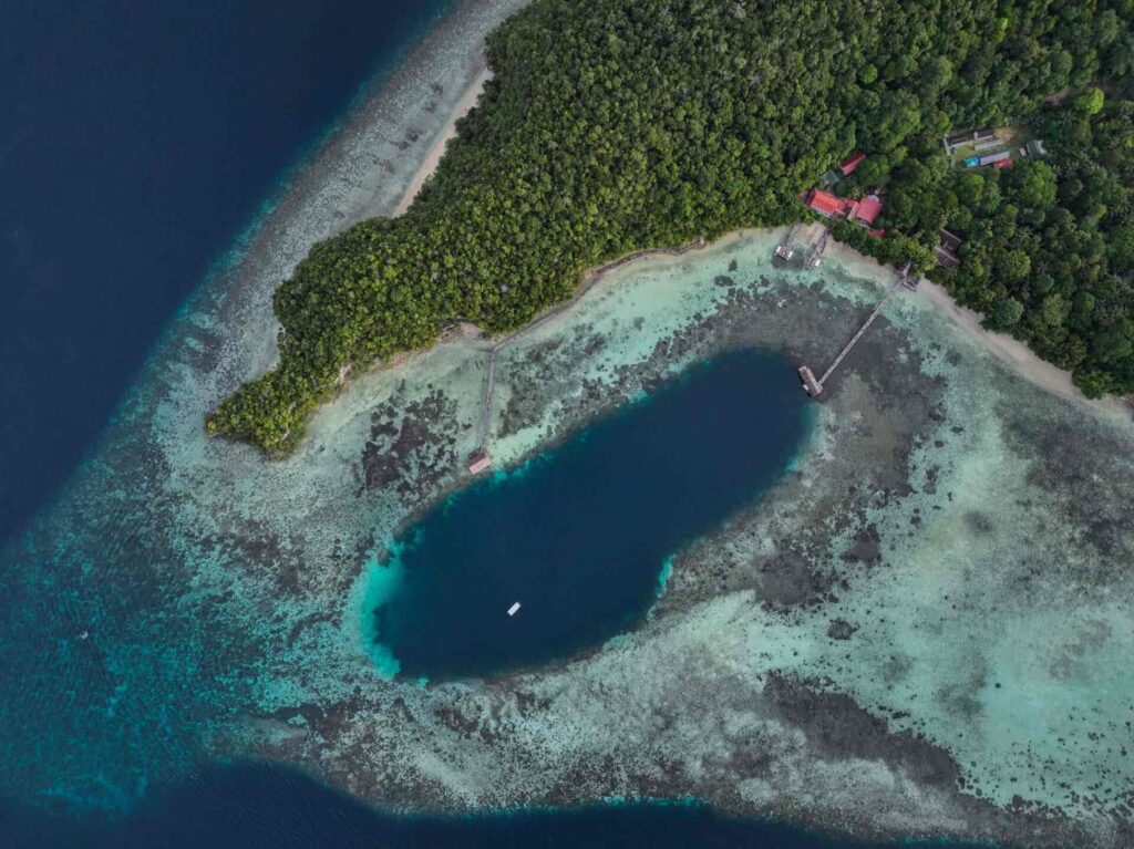 aerial view of sorido bay resort in Raja Ampat, Indonesia by papua Diving Resorts