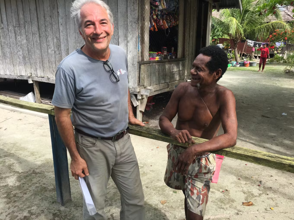 max ammer with one of local papuan villagers smiling